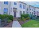 Two-story home featuring a modern facade with a well-maintained front yard at 119 Capital Ave # E, Mooresville, NC 28117