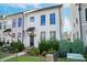 Charming two-story home featuring neat landscaping and a welcoming front entrance with an awning at 119 Capital Ave # E, Mooresville, NC 28117