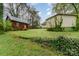 Large backyard with outbuilding, detached garage, and mature trees at 119 E End Ave, Statesville, NC 28677