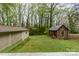 Exterior view of backyard with outbuilding and detached garage at 119 E End Ave, Statesville, NC 28677