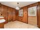 Cozy dining area features wood paneling and an airy light fixture at 119 E End Ave, Statesville, NC 28677