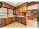 Traditional kitchen features wood cabinets, stainless steel appliances, and a breakfast nook at 119 E End Ave, Statesville, NC 28677