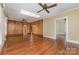 Sunlit living area with hardwood floors, wood paneling, and a skylight at 119 E End Ave, Statesville, NC 28677