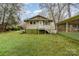 Back exterior view of home with stairs and backyard at 119 E End Ave, Statesville, NC 28677
