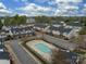 Beautiful aerial view of the neighborhood swimming pool and well-maintained townhome community at 12550 Mcgrath Dr, Charlotte, NC 28269