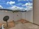 Private backyard with a fence and small patio at 12550 Mcgrath Dr, Charlotte, NC 28269