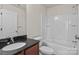 Bathroom features a single sink vanity with granite countertops, a tub/shower and toilet at 12550 Mcgrath Dr, Charlotte, NC 28269