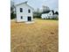 Large, newly seeded backyard with a concrete patio, perfect for outdoor entertaining and relaxation at 1406 Mason St, Kannapolis, NC 28081