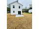 Spacious backyard showcasing a concrete patio and newly seeded lawn, offering ample space for activities at 1406 Mason St, Kannapolis, NC 28081
