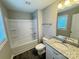 Bathroom with shower/tub combo, gray countertop, and modern sink at 1406 Mason St, Kannapolis, NC 28081