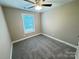 Bedroom featuring carpet, a ceiling fan, and a window providing natural light at 1406 Mason St, Kannapolis, NC 28081