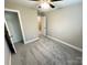 Neutral bedroom with gray carpet and a ceiling fan, offering a comfortable and inviting space at 1406 Mason St, Kannapolis, NC 28081