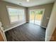 Bedroom featuring wood-look floors, a sliding glass door to the backyard, and bright natural light at 1406 Mason St, Kannapolis, NC 28081