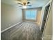 Bedroom featuring soft carpeting, a ceiling fan, and natural light from the window at 1406 Mason St, Kannapolis, NC 28081