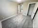 Comfortable bedroom with neutral walls, soft gray carpet, and a spacious closet, ideal for storage at 1406 Mason St, Kannapolis, NC 28081