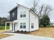 Charming two-story home with white siding, dark accents, and a welcoming front porch at 1406 Mason St, Kannapolis, NC 28081