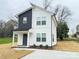 Charming two-story home with white siding, dark accents, and a welcoming front porch at 1406 Mason St, Kannapolis, NC 28081