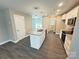 Modern kitchen with granite counters, stainless appliances, and a center island with sink at 1406 Mason St, Kannapolis, NC 28081
