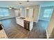 Kitchen island with stainless steel dishwasher has an open concept view at 1406 Mason St, Kannapolis, NC 28081
