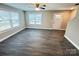 Living room featuring ample natural light, wood-look flooring, and a neutral color scheme at 1406 Mason St, Kannapolis, NC 28081