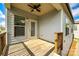 Back porch with ceiling fan, wooden floor, and railing, creating a cozy outdoor space at 1625 Carolina Orchards Blvd, Fort Mill, SC 29715