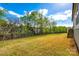 Fenced backyard with grass, trees, and landscaping offers a secure outdoor space at 1625 Carolina Orchards Blvd, Fort Mill, SC 29715