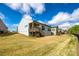 Spacious backyard with patio and stairs, fenced for privacy, perfect for entertaining at 1625 Carolina Orchards Blvd, Fort Mill, SC 29715