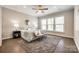 Bright primary bedroom with large windows, hardwood floors, and neutral decor at 1625 Carolina Orchards Blvd, Fort Mill, SC 29715