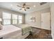 Primary bedroom featuring large windows, hardwood floors and lots of natural light at 1625 Carolina Orchards Blvd, Fort Mill, SC 29715
