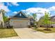 Charming home with manicured lawn, stone accents, and a two-car garage at 1625 Carolina Orchards Blvd, Fort Mill, SC 29715