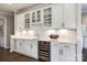 This kitchen features white cabinets, subway tile backsplash, and a stainless-steel wine cooler at 1625 Carolina Orchards Blvd, Fort Mill, SC 29715