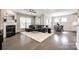 Open concept living room and dining room with fireplace and hardwood floors at 1625 Carolina Orchards Blvd, Fort Mill, SC 29715
