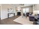 Cozy living room with fireplace, hardwood floors, and ample natural light at 1625 Carolina Orchards Blvd, Fort Mill, SC 29715