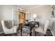 Stylish office with French doors, neutral decor, a decorative desk, and two upholstered chairs at 1625 Carolina Orchards Blvd, Fort Mill, SC 29715