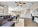Open concept living room and kitchen with hardwood floors and lots of natural light at 1625 Carolina Orchards Blvd, Fort Mill, SC 29715