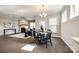 Open concept dining area and living room with hardwood floors and lots of natural light at 1625 Carolina Orchards Blvd, Fort Mill, SC 29715