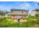 Rear view of the home showcasing a spacious, fenced backyard with a concrete patio for outdoor enjoyment at 200 Boysenberry Dr, China Grove, NC 28023