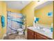 Bright bathroom with shower and single vanity and a clean, beach-inspired aesthetic at 200 Boysenberry Dr, China Grove, NC 28023
