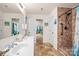 This bathroom boasts a double sink vanity, walk-in shower and access to another room at 200 Boysenberry Dr, China Grove, NC 28023