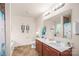 Well-lit bathroom with double sinks, large mirror, and modern fixtures for convenience at 200 Boysenberry Dr, China Grove, NC 28023