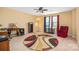 Spacious room with a work desk, bookshelf and accent chair, perfect for relaxation at 200 Boysenberry Dr, China Grove, NC 28023