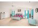 Bright primary bedroom featuring large windows and a ceiling fan at 200 Boysenberry Dr, China Grove, NC 28023