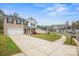 Beautiful home with a long driveway and green lawn in a Gathering-friendly neighborhood at 200 Boysenberry Dr, China Grove, NC 28023