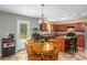 Bright kitchen includes a kitchen island and a wooden table, offering convenience and style at 200 Boysenberry Dr, China Grove, NC 28023