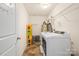 Efficient laundry area with modern appliances, and storage for cleaning supplies and essentials at 200 Boysenberry Dr, China Grove, NC 28023