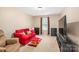 Living room features a red couch and view of the front yard at 200 Boysenberry Dr, China Grove, NC 28023