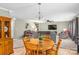 Spacious living room boasts a wooden table and plenty of comfortable seating at 200 Boysenberry Dr, China Grove, NC 28023