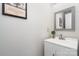 Half bathroom featuring a white vanity, mirror and simple decor at 2005 Dunsmore Ln, Waxhaw, NC 28173