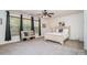 Bright bedroom features a large window, neutral decor, and carpeted flooring at 2005 Dunsmore Ln, Waxhaw, NC 28173