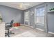 Bedroom with neutral carpet, ceiling fan, ample natural light from dual windows, and desk area at 2005 Dunsmore Ln, Waxhaw, NC 28173
